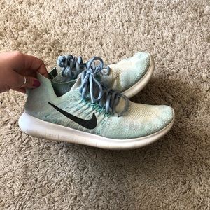 Teal flyknit Nike sneakers